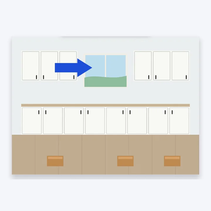 The photo of the new cabinets with an arrow added, pointing at the new window